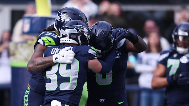 Seattle Seahawks DE DeMarcus Lawrence celebrates after recovering a fumble to score a touchdown against the Arizona Cardinals