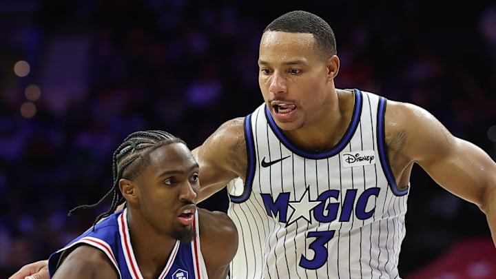 Philadelphia 76ers guard Tyrese Maxey dribbles past Orlando Magic guard Desmond Bane. Philadelphia 76ers guard Tyrese Maxey dribbles past Orlando Magic guard Desmond Bane.
