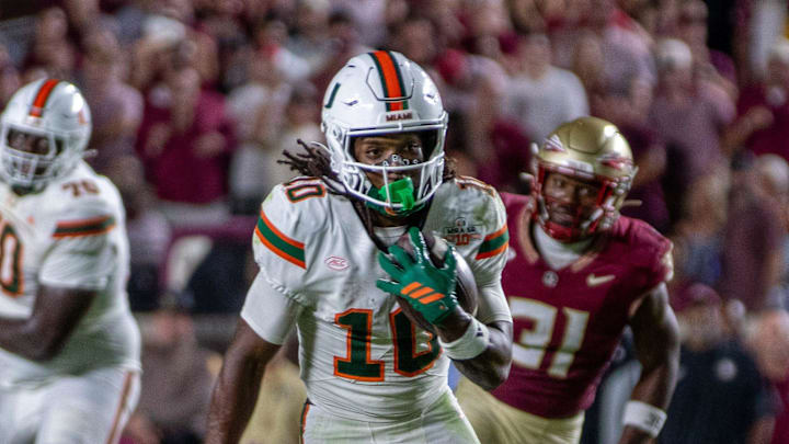 University of Miami wide receiver Malachi Toney (10) runs after catching a pass from quarterback Carson Beck (11).