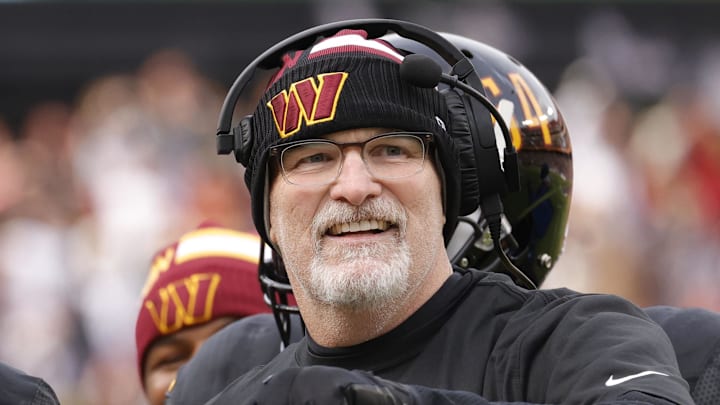 Dec 1, 2024; Landover, Maryland, USA; Washington Commanders head coach Dan Quinn (right) celebrates with Commanders running back Brian Robinson Jr. (8) after scoring a touchdown against the Tennessee Titans during the first half at Northwest Stadium. Mandatory Credit: Amber Searls-Imagn Images