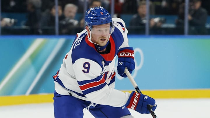 Feb 22, 2026; Milan, Italy; Jack Eichel (9) of the United States in action against Mitch Marner (93) of Canada in the men's ice hockey gold medal game during the Milano Cortina 2026 Olympic Winter Games at Milano Santagiulia Ice Hockey Arena. Mandatory Credit: Geoff Burke-Imagn Images
