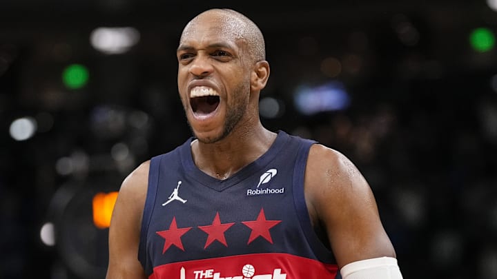 Dec 31, 2025; Milwaukee, Wisconsin, USA;  Washington Wizards forward Khris Middleton (22) celebrates after Washington Wizards guard CJ McCollum (3) (not pictured) scored a basket during the fourth quarter against the Milwaukee Bucks at Fiserv Forum. Mandatory Credit: Jeff Hanisch-Imagn Images