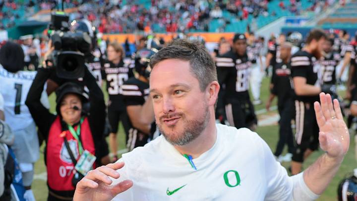 Jan 1, 2026; Miami Gardens, FL, USA; Oregon Ducks head coach Dan Lanning reacts after getting a gatorade bath from his players following the 2025 Orange Bowl and quarterfinal game of the College Football Playoff against the Texas Tech Red Raiders at Hard Rock Stadium. Mandatory Credit: Sam Navarro-Imagn Images Jan 1, 2026; Miami Gardens, FL, USA; Oregon Ducks head coach Dan Lanning reacts after getting a gatorade bath from his players following the 2025 Orange Bowl and quarterfinal game of the College Football Playoff against the Texas Tech Red Raiders at Hard Rock Stadium. Mandatory Credit: Sam Navarro-Imagn Images