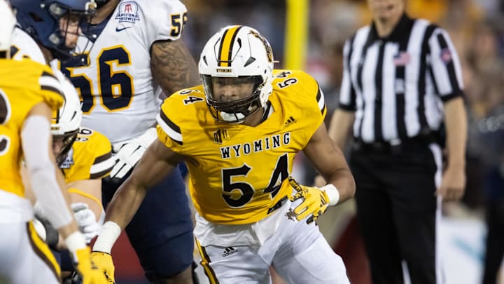 Dec 30, 2023; Tucson, AZ, USA; Wyoming Cowboys defensive end Sabastian Harsh (54) against the Toledo Rockets during the Arizona Bowl at Arizona Stadium. Mandatory Credit: Mark J. Rebilas-USA TODAY Sports Dec 30, 2023; Tucson, AZ, USA; Wyoming Cowboys defensive end Sabastian Harsh (54) against the Toledo Rockets during the Arizona Bowl at Arizona Stadium. Mandatory Credit: Mark J. Rebilas-USA TODAY Sports