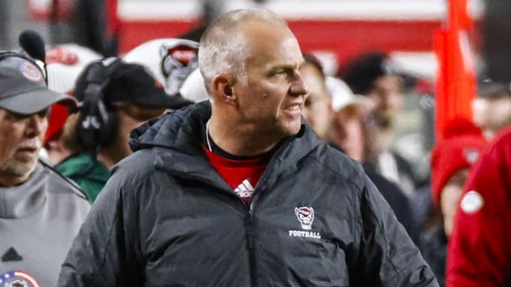 Nov 29, 2025; Raleigh, North Carolina, USA; NC State Wolfpack head coach Dave Doeren reacts during the first half of the game against the North Carolina Tar Heels at Carter-Finley Stadium.  Mandatory Credit: Jaylynn Nash-Imagn Images