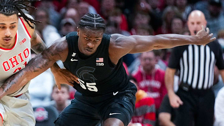 Ohio State Buckeyes forward Devin Royal (21) fights for the ball against Michigan State Spartans forward Coen Carr (55) in the first half at Value City Arena on Friday, Jan. 3, 2025 in Columbus, Ohio.