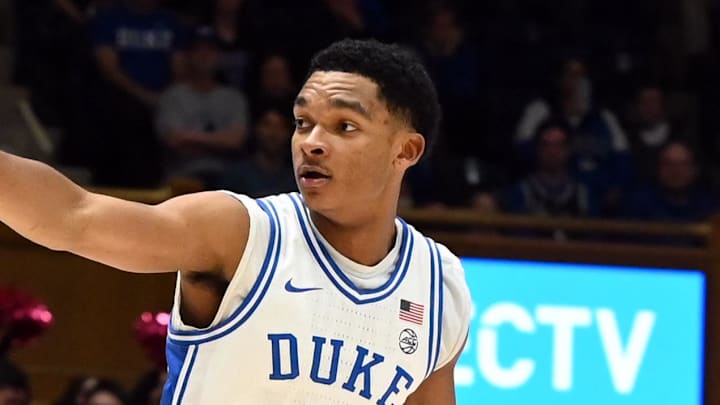 Feb 14, 2026; Durham, North Carolina, USA;Duke Blue Devils guard Caleb Foster (1) directs the offense as Clemson Tigers guard Jestin Porter (1) defends during the second half at Cameron Indoor Stadium. Mandatory Credit: Rob Kinnan-Imagn Images