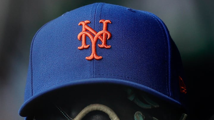 Aug 8, 2024; Denver, Colorado, USA; A New York Mets hat and glove in the dugout in the second inning against the Colorado Rockies at Coors Field. Mandatory Credit: Isaiah J. Downing-Imagn Images