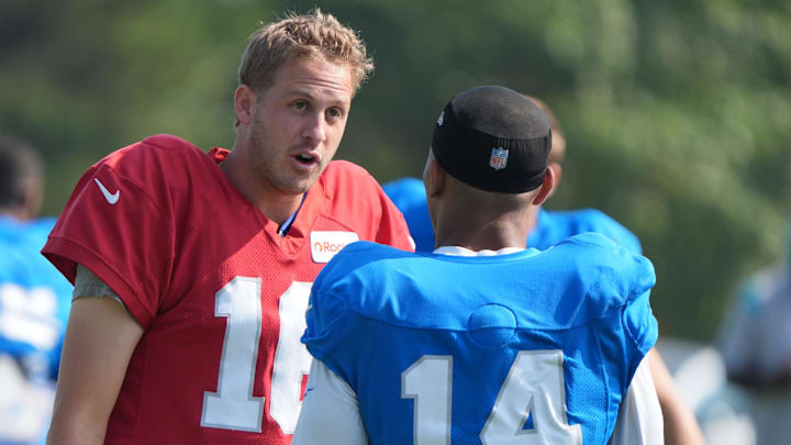 Detroit Lions QB Jared Goff talks with WR Amon-Ra St. Brown during practice at the Lions training facility in Allen Park, Thursday, Aug. 14 2025