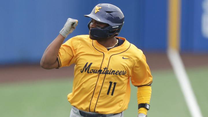 West Virginia Mountaineers graduate Sean Smith (11) pumps his first after hitting a home run against Kansas Jayhawks during the game inside Hoglund Ballpark on May 10, 2026.