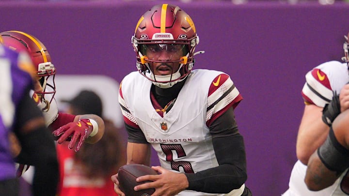 Dec 7, 2025; Minneapolis, Minnesota, USA; Washington Commanders quarterback Jayden Daniels (5) drops back to pass against the Minnesota Vikings during the first half at U.S. Bank Stadium. Mandatory Credit: Brad Rempel-Imagn Images