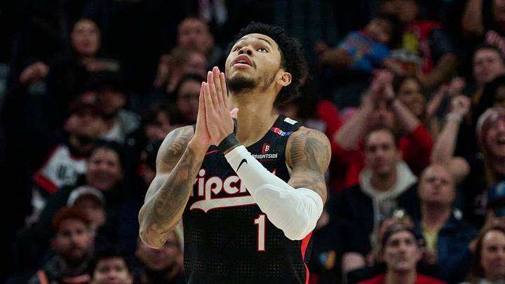 Jan 11, 2025; Portland, Oregon, USA; Portland Trail Blazers guard Anfernee Simons (1) reacts after being fouled and scoring a basket during the second half against the Miami Heat at Moda Center. Mandatory Credit: Troy Wayrynen-Imagn Images