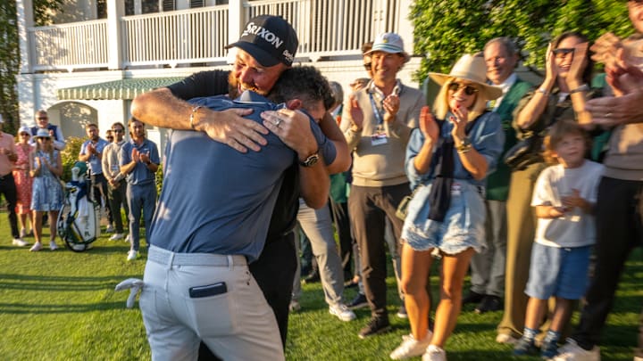 Shane Lowry embraces Rory McIlroy after his win at the 2025 Masters.