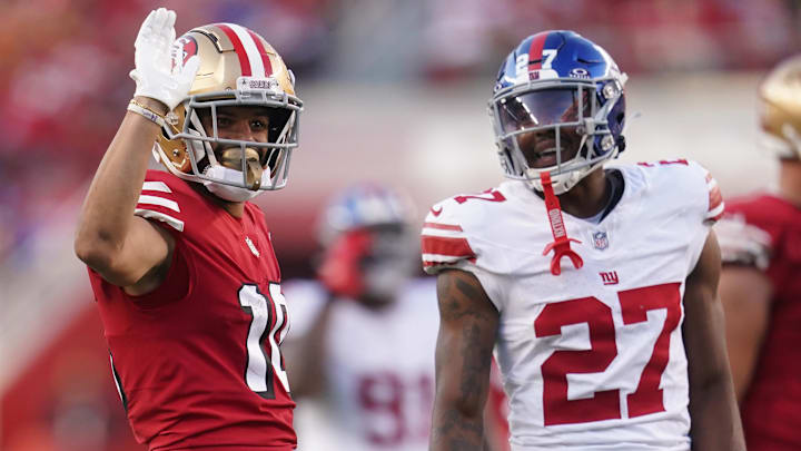 Former San Francisco 49ers wide receiver Ronnie Bell (10) gestures after making a catch for a first down in front of former New York Giants safety Jason Pinnock (27) in the second quarter at Levi's Stadium.