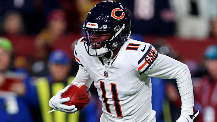 Chicago Bears wide receiver DeAndre Carter (11) runs with the ball during the second half against the Washington Commanders at Commanders Field.