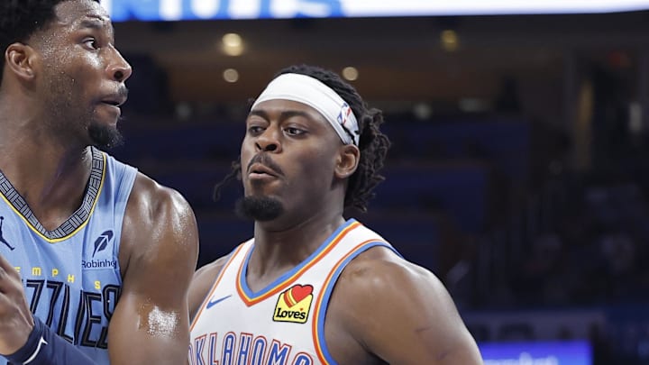 Mar 27, 2025; Oklahoma City, Oklahoma, USA; Memphis Grizzlies forward Jaren Jackson Jr. (13) moves the ball down the court beside Oklahoma City Thunder guard Luguentz Dort (5) during the second half at Paycom Center. Mandatory Credit: Alonzo Adams-Imagn Images