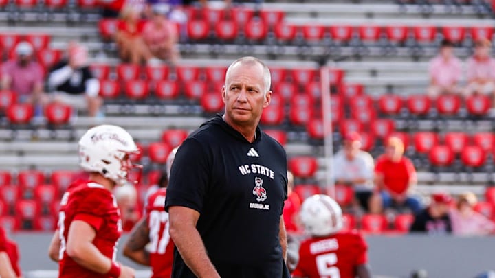 Aug 28, 2025; Raleigh, North Carolina, USA; North Carolina State Wolfpack head coach Dave Doeren walks among his players during the warmups prior to the game against East Carolina Pirates at Carter-Finley Stadium. Mandatory Credit: Jaylynn Nash-Imagn Images Aug 28, 2025; Raleigh, North Carolina, USA; North Carolina State Wolfpack head coach Dave Doeren walks among his players during the warmups prior to the game against East Carolina Pirates at Carter-Finley Stadium. Mandatory Credit: Jaylynn Nash-Imagn Images