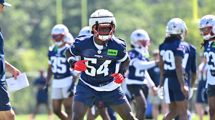 Jul 23, 2025; Foxborough, MA, USA; New England Patriots defensive end Truman Jones (54) warms up as head coach Mike Vrabel watches during day one of training camp at Gillette Stadium. Mandatory Credit: Eric Canha-Imagn Images Jul 23, 2025; Foxborough, MA, USA; New England Patriots defensive end Truman Jones (54) warms up as head coach Mike Vrabel watches during day one of training camp at Gillette Stadium. Mandatory Credit: Eric Canha-Imagn Images