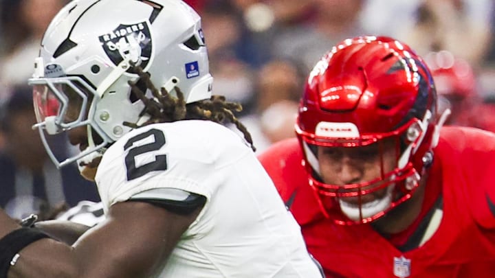 Dec 21, 2025; Houston, Texas, USA; Las Vegas Raiders running back Ashton Jeanty (2) rushes against the Houston Texans during the second quarter at NRG Stadium. Mandatory Credit: Thomas Shea-Imagn Images