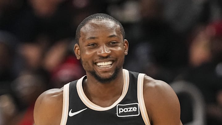 Jonathan Kuminga (0) reacts after making a three point shot against the Washington Wizards during the first half at State Farm Arena