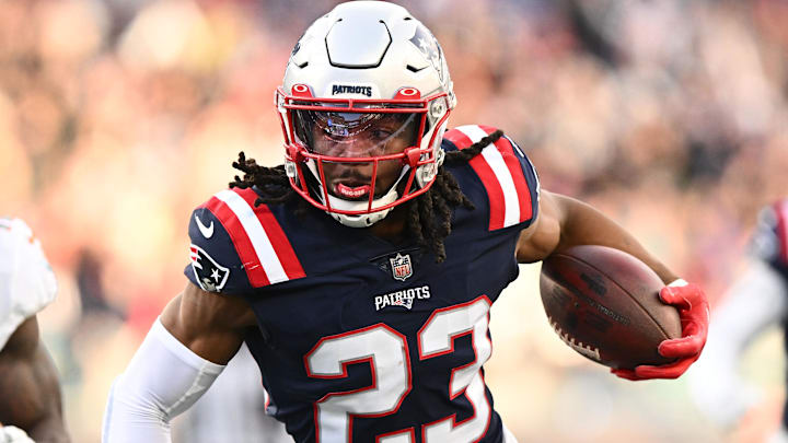 Jan 1, 2023; Foxborough, Massachusetts, USA; New England Patriots safety Kyle Dugger (23) runs for a touchdown after intercepting the ball during the second half of agame against the Miami Dolphins at Gillette Stadium. Mandatory Credit: Brian Fluharty-Imagn Images