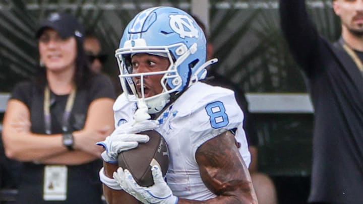 Sep 20, 2025; Orlando, Florida, USA; North Carolina Tar Heels wide receiver Kobe Paysour (8) runs the ball during the second half against the UCF Knights at the Bounce House Stadium. Mandatory Credit: Mike Watters-Imagn Images Sep 20, 2025; Orlando, Florida, USA; North Carolina Tar Heels wide receiver Kobe Paysour (8) runs the ball during the second half against the UCF Knights at the Bounce House Stadium. Mandatory Credit: Mike Watters-Imagn Images