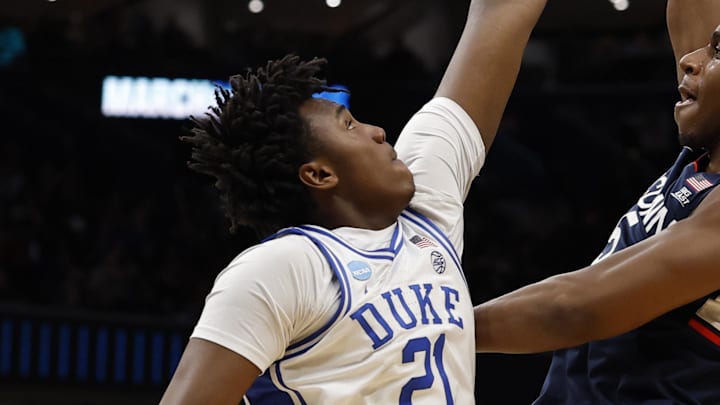 Mar 29, 2026; Washington, DC, USA; UConn Huskies forward Tarris Reed Jr. (5) shoots the ball over Duke Blue Devils center Patrick Ngongba (21) during an Elite Eight game of the East Regional of the men's 2026 NCAA Tournament at Capital One Arena. Mandatory Credit: Geoff Burke-Imagn Images