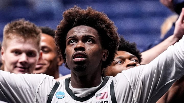 Michigan State forward Coen Carr (55) high fives fans after 92-67 win over North Dakota State at the NCAA Tournament First Round at KeyBank Center in Buffalo on Thursday, March 19, 2026.
