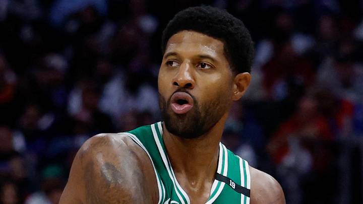 Oct 20, 2026; Detroit, Michigan, USA;  Boston Celtics forward Paul George (13) is defended by Detroit Pistons forward-center John Collins (20) in the second half at Little Caesars Arena.  Mandatory Credit: Rick Osentoski-Imagn Images
