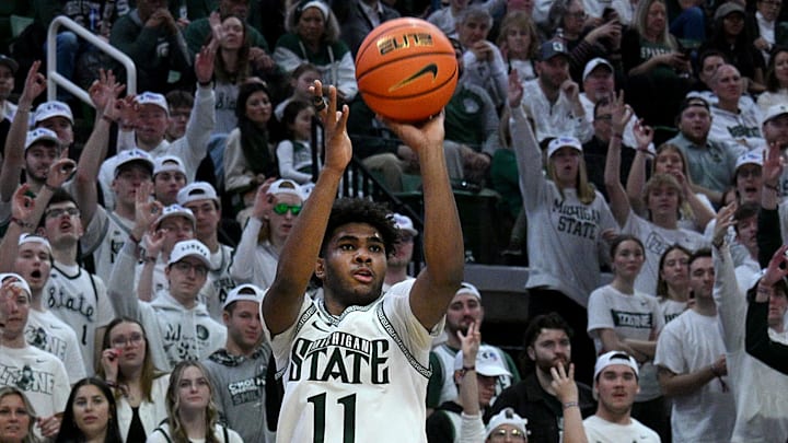 Feb 8, 2025; East Lansing, Michigan, USA;  Michigan State Spartans guard Jase Richardson (11) shoots the ball against the Oregon Ducks during the second half at Jack Breslin Student Events Center. Mandatory Credit: Dale Young-Imagn Images