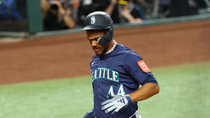 Seattle Mariners center fielder Julio Rodriguez (44) scores during a game against the Texas Rangers in June.