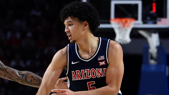 Dec 13, 2025; Birmingham, Alabama, USA; Arizona Wildcats guard Brayden Burries (5) passes the ball guarded by Alabama Crimson Tide guard Labaron Philon (0) and Alabama Crimson Tide center Noah Williamson (15) during the second half at Legacy Arena at BJCC. Mandatory Credit: David Leong-Imagn Images