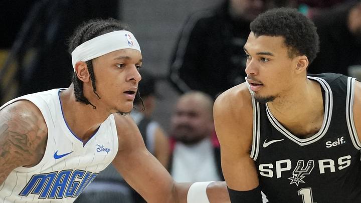 Jan 31, 2024; San Antonio, Texas, USA;  San Antonio Spurs center Victor Wembanyama (1) looks to pass in front of Orlando Magic forward Paolo Banchero (5) in the second half at Frost Bank Center. Mandatory Credit: Daniel Dunn-USA TODAY Sportss