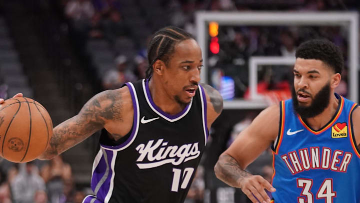 Mar 25, 2025; Sacramento, California, USA; Sacramento Kings guard DeMar DeRozan (10) dribbles past Oklahoma City Thunder guard Kenrich Williams (34) in the first quarter at the Golden 1 Center. Mandatory Credit: Cary Edmondson-Imagn Images Mar 25, 2025; Sacramento, California, USA; Sacramento Kings guard DeMar DeRozan (10) dribbles past Oklahoma City Thunder guard Kenrich Williams (34) in the first quarter at the Golden 1 Center. Mandatory Credit: Cary Edmondson-Imagn Images