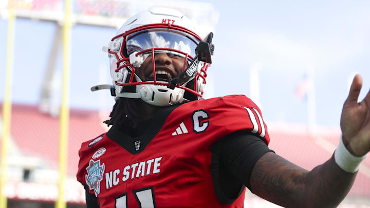 Dec 19, 2025; Tampa, FL, USA; NC State Wolfpack quarterback CJ Bailey (11) runs into the end zone for a touchdown against the Memphis Tigers in the first quarter during the Gasparilla Bowl at Raymond James Stadium. Mandatory Credit: Nathan Ray Seebeck-Image Images Dec 19, 2025; Tampa, FL, USA; NC State Wolfpack quarterback CJ Bailey (11) runs into the end zone for a touchdown against the Memphis Tigers in the first quarter during the Gasparilla Bowl at Raymond James Stadium. Mandatory Credit: Nathan Ray Seebeck-Image Images