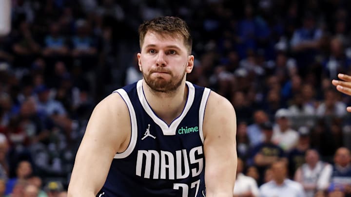 Jun 14, 2024; Dallas, Texas, USA; Dallas Mavericks guard Luka Doncic (77) passes the ball against Boston Celtics center Al Horford (42) during game four of the 2024 NBA Finals at American Airlines Center. Mandatory Credit: Peter Casey-Imagn Images
