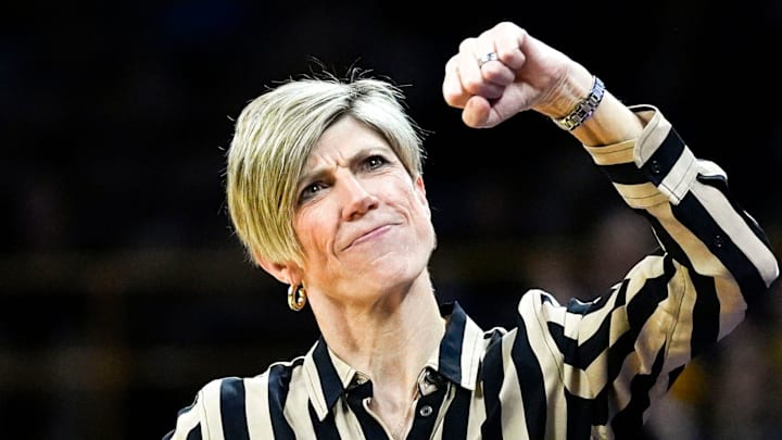 Iowa head coach Jan Jensen fist-pumps toward the end of a basketball game against the Ohio State Buckeyes Jan. 25, 2026 at Carver-Hawkeye Arena in Iowa City, Iowa.