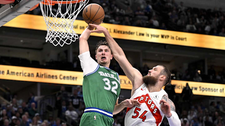 Oct 26, 2025; Dallas, Texas, USA; Dallas Mavericks forward Cooper Flagg (32) dunks the ball past Toronto Raptors forward Sandro Mamukelashvili (54) during the third quarter at the American Airlines Center. Mandatory Credit: Jerome Miron-Imagn Images Oct 26, 2025; Dallas, Texas, USA; Dallas Mavericks forward Cooper Flagg (32) dunks the ball past Toronto Raptors forward Sandro Mamukelashvili (54) during the third quarter at the American Airlines Center. Mandatory Credit: Jerome Miron-Imagn Images