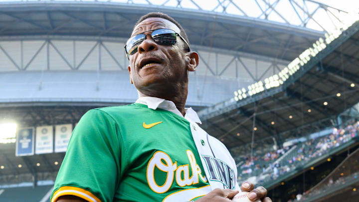 MLB Hall of Famer Rickey Henderson throws the first pitch during a game between the Athletics and Seattle Mariners on Sept. 29 at T-Mobile Park.