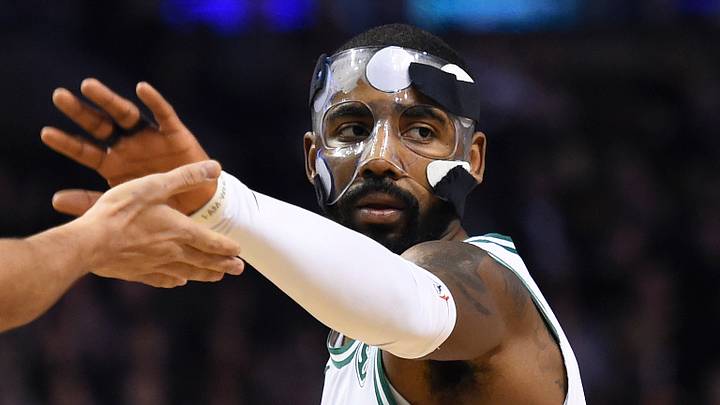 Nov 30, 2017; Boston, MA, USA; Boston Celtics guard Kyrie Irving (11) celebrates with forward Jayson Tatum (0) after scoring during the first half against the Philadelphia 76ers at TD Garden. Mandatory Credit: Bob DeChiara-USA TODAY Sports