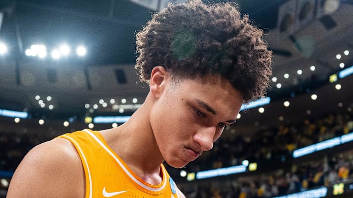 Tennessee forward Nate Ament (10) walks off the court as Michigan players celebrate their Final Four berth behind him after a NCAA Tournament Elite 8 game between Tennessee and Michigan at the United Center in Chicago on March 29, 2026. Tennessee forward Nate Ament (10) walks off the court as Michigan players celebrate their Final Four berth behind him after a NCAA Tournament Elite 8 game between Tennessee and Michigan at the United Center in Chicago on March 29, 2026.