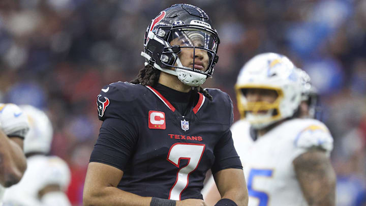 Jan 11, 2025; Houston, Texas, USA; Houston Texans quarterback C.J. Stroud (7) reacts during the game against the Los Angeles Chargers in an AFC wild card game at NRG Stadium. Mandatory Credit: Troy Taormina-Imagn Images