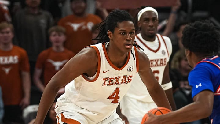 Texas Longhorns forward Jamie Vinson (4) guards Houston Christian guard Elijah Brooks (4) during the game at the Moody Center on Friday, Nov. 8, 2024, in Austin.