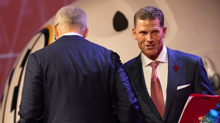 Oklahoma head coach Brent Venables shaking hands with SEC commissioner Greg Sankey