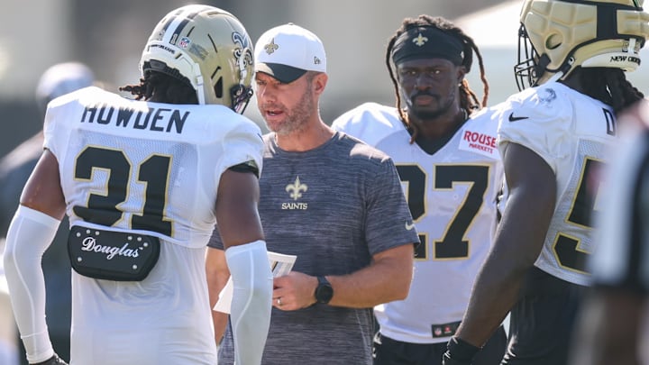Jul 28, 2025; Metairie, LA, USA;  New Orleans Saints defensive coordinator Brandon Staley gives direction to safety Jordan Howden (31) at Ochsner Sports Performance Center. Mandatory Credit: Stephen Lew-Imagn Images