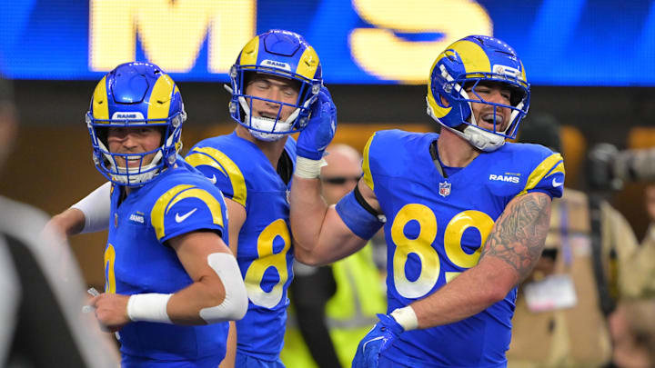 Jan 4, 2026; Inglewood, California, USA;  Los Angeles Rams tight end Tyler Higbee (89) reacts with quarterback Matthew Stafford (9) after scoring a touchdown against the Arizona Cardinals during the second half at SoFi Stadium. Mandatory Credit: Jayne Kamin-Oncea-Imagn Images