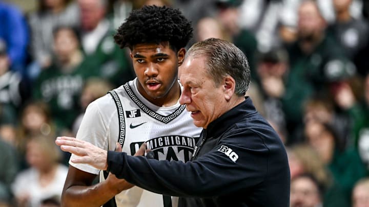 Michigan State's Jase Richardson, left, talks with head coach Tom Izzo during a break in the action in the game against Florida Atlantic on Saturday, Dec. 21, 2024, in East Lansing.