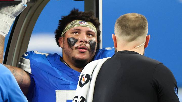 Detroit Lions offensive lineman Christian Mahogany (73) is helped off the field after a hip injury Detroit Lions offensive lineman Christian Mahogany (73) is helped off the field after a hip injury