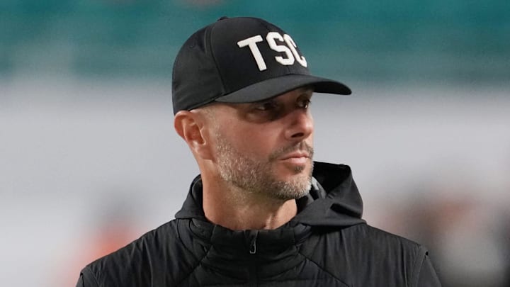 Jan 19, 2026; Miami Gardens, FL, USA; Las Vegas Raiders general manager John Spytek walks on the sideline before the CFP National Championship college football game between the Indiana Hoosiers and the Miami Hurricanes at Hard Rock Stadium. Mandatory Credit: Kirby Lee-Imagn Images