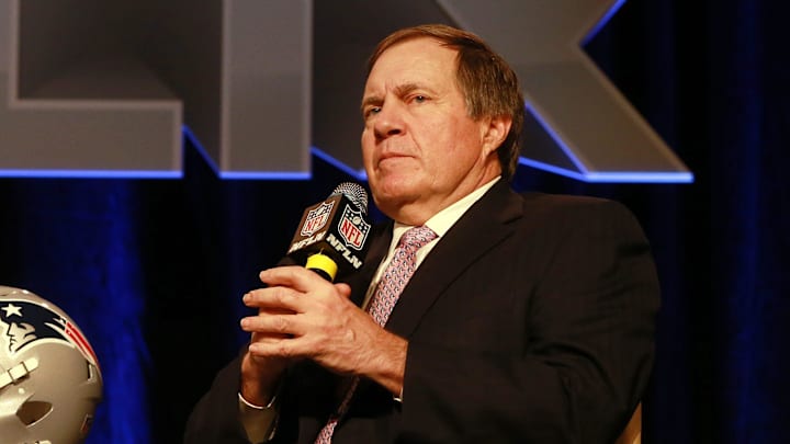 2015: Patriots head coach Bill Belichick answers questions during a press conference with the Vince Lombardi trophy as the New England Patriots and Seattle Seahawks prepare for Super Bowl XLIX.